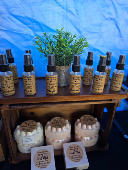 Collection of small bottles and containers on a wooden shelf with a blue background