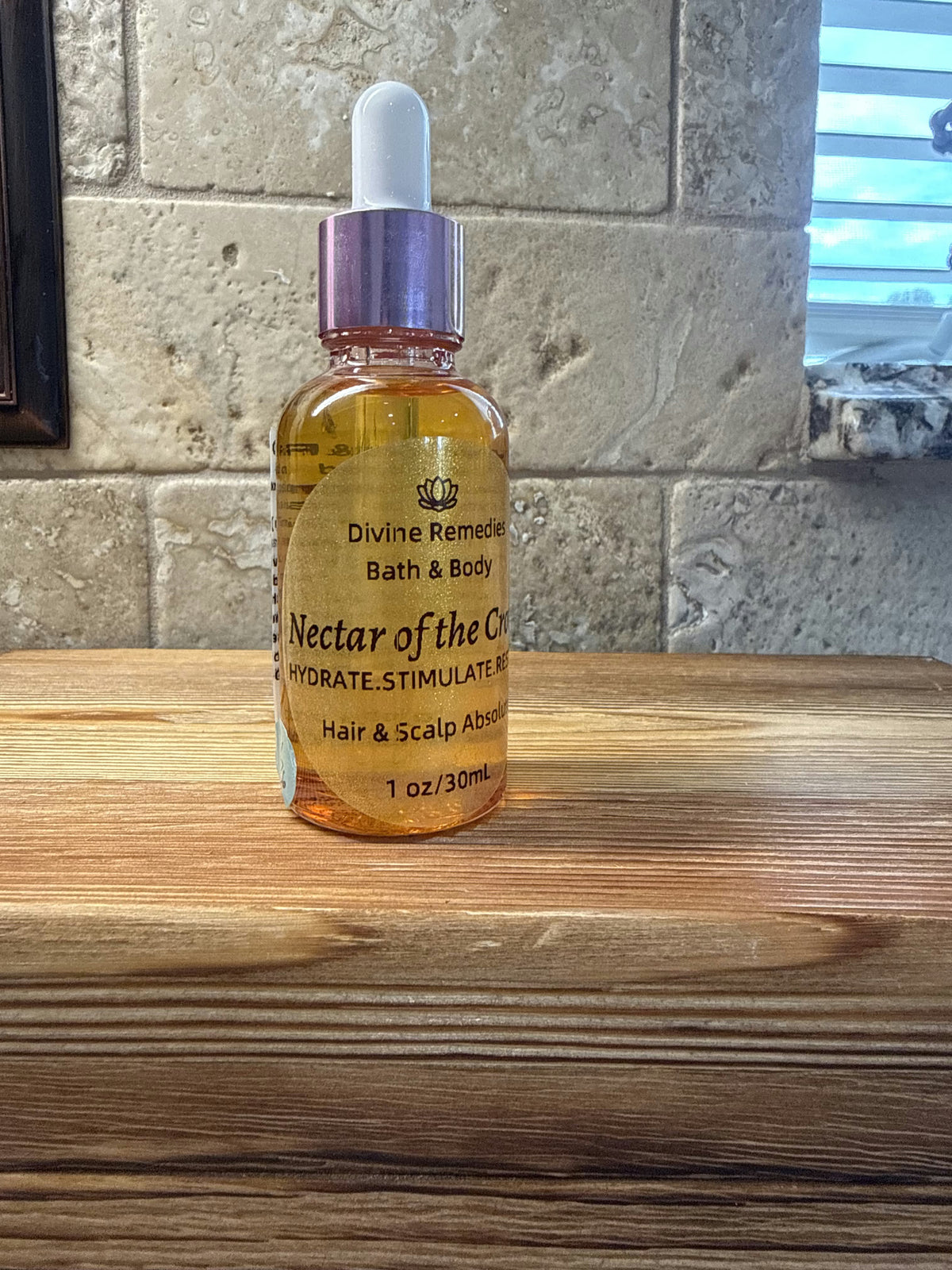 Front of Divine Remedies Nectar of the Crown Hair and Scalp Absolute 1 oz dropper bottle