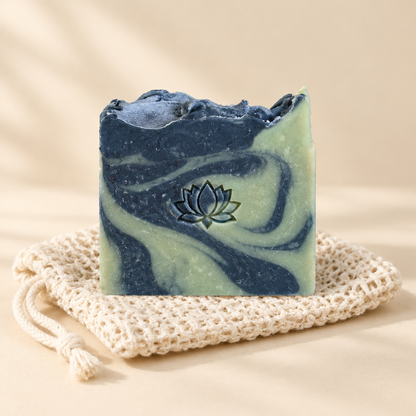 Pink swirled lotus soap bar on its woven pouch